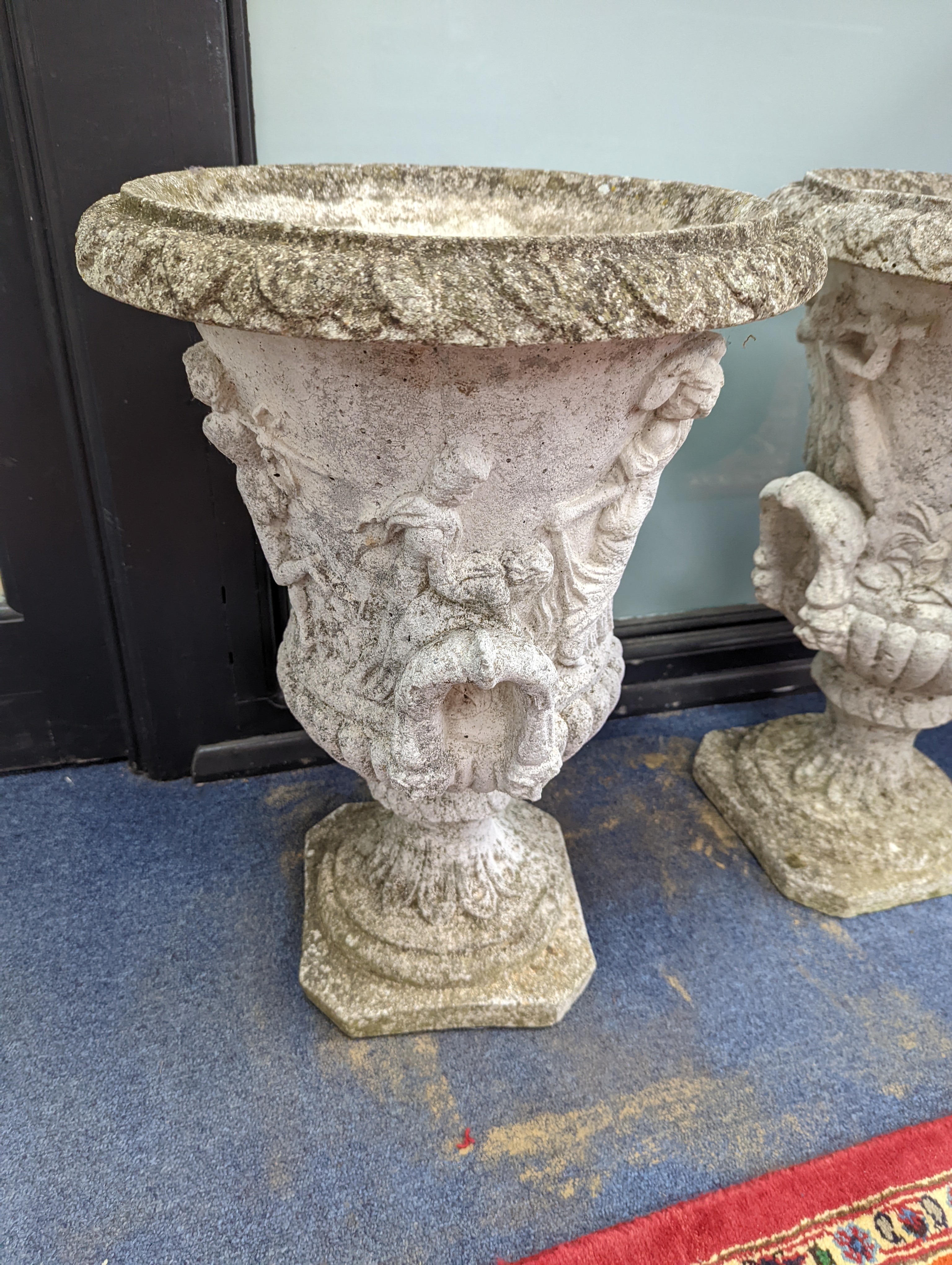 A pair of reconstituted stone campana garden urns, diameter 40cm, height 56cm